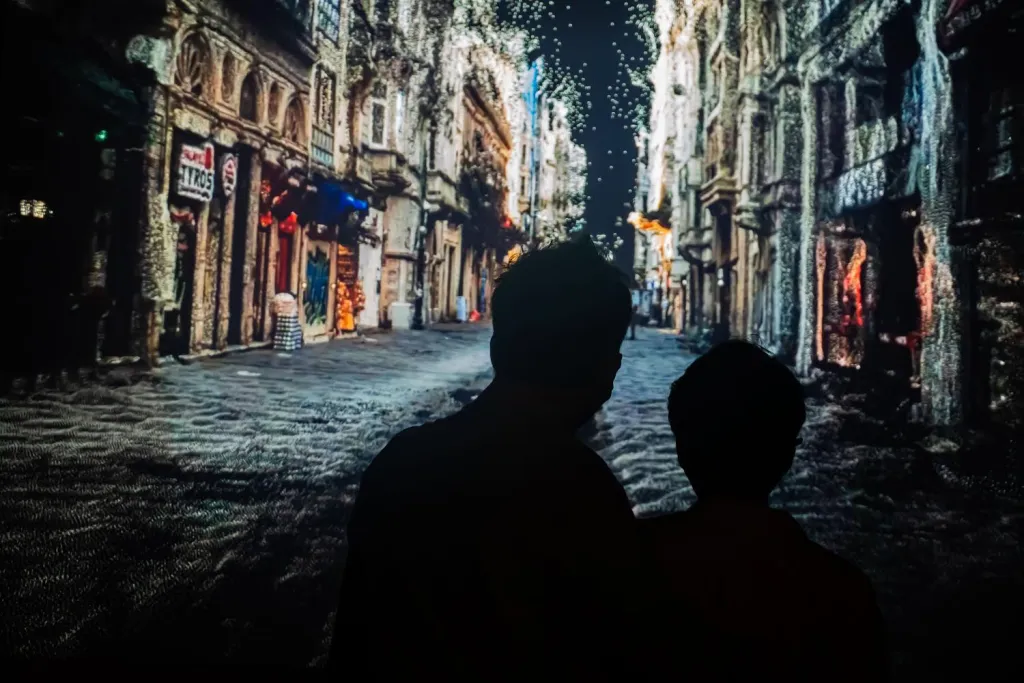 Photograph from Zeynep Abes's film Istiklal showing two people looking down a city street.