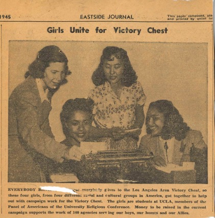 Newspaper clipping showing four members of the Panel of Americans helping with the WWII War Chest campaign looking at a typewriter.